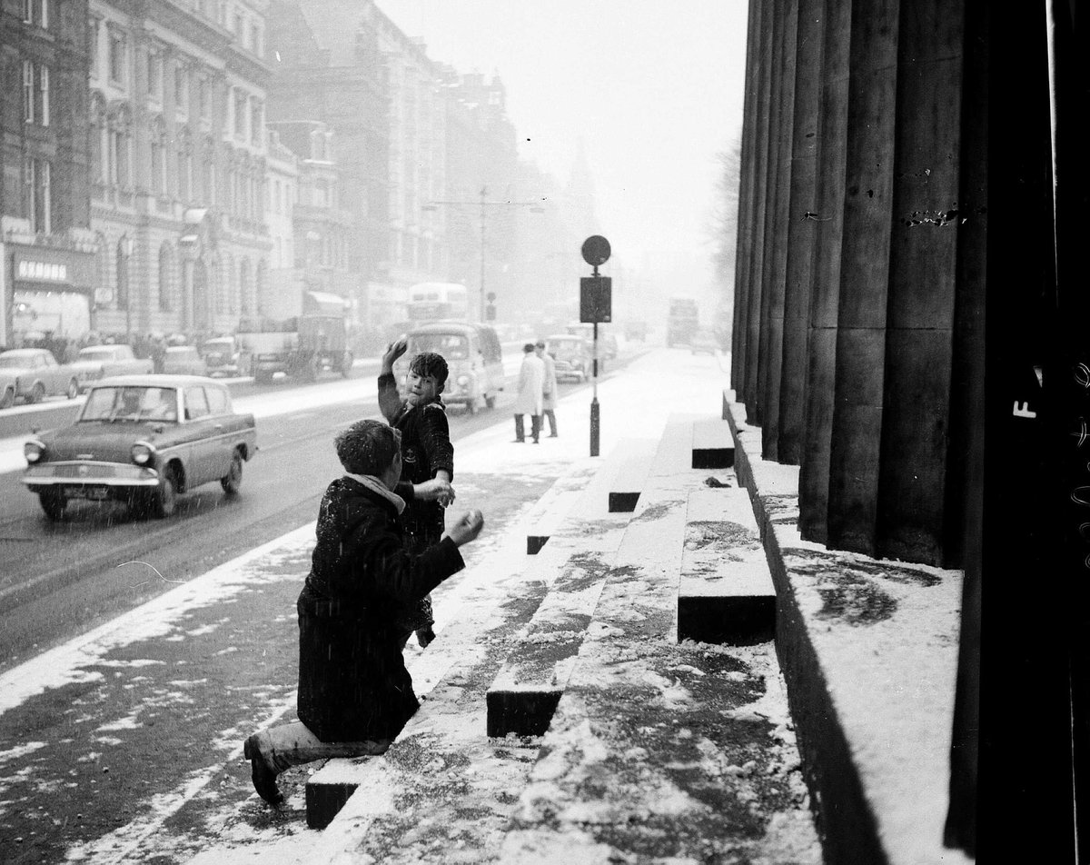 Day 17.The Ghosts of Christmas past  #AdventCalendar.Kids having a snowball fight outside The Royal Scottish Academy on Princes Street, Edinburgh, 28th December, 1962. Photo TSPL