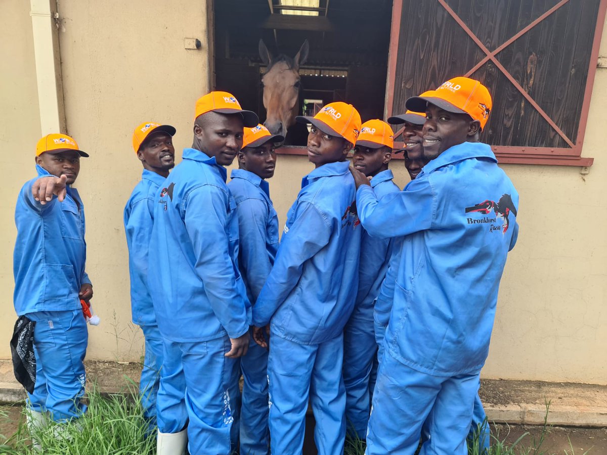 WorldSportsBet's tweet photo. World Sports Betting are proud to announce that the newly established Bronkhorst stables are now proudly sponsored by WSB 🧡 💙

And don’t the stable staff look great in the familiar light blue of Owner/Trainer Fanie Bronkhorst 🏇🏿 https://t.co/Xxg7HYyyJF