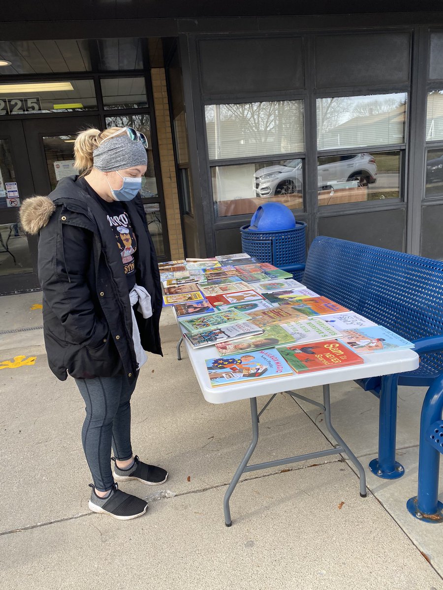 Mrs. Cordell sifting through some of the books available for free at WGS!  Stop by, there are still many titles to choose from! <a href="/PrincipalMonro1/">PrincipalMonroe</a> #wgs118life #d118life