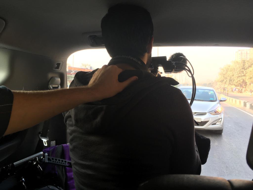 Btw, here's how things went behind-the-scenes. That's  @dwtkns trying to keep me from flying out the back of our car, while shooting Aamya on her way to school.
