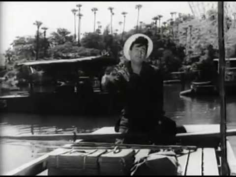 In the scene leading up to the song "Yun Hi Chala Chal Rahi", we see  @iamsrk listening to 2 Dev Anand classics - Khoya Khoya Chand and Akela Hun Main Is Duniya Me.