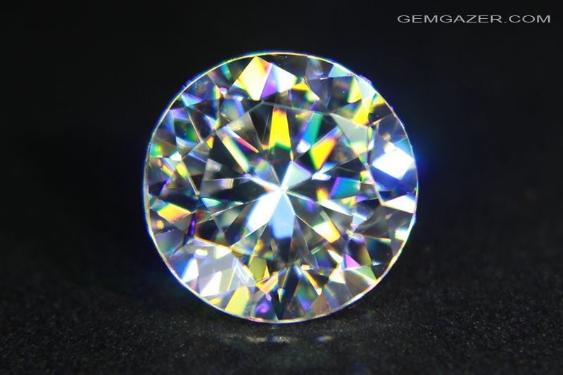 25. STRONTIUM TITANATE is a synthetic diamond (more sparkly, less hard, much cheaper). Its dielectric constant is enormous: ~20,000. This means that an electric charge Q inside it only produces the force of a charge Q/20,000. Nearly all its charge is "cancelled".