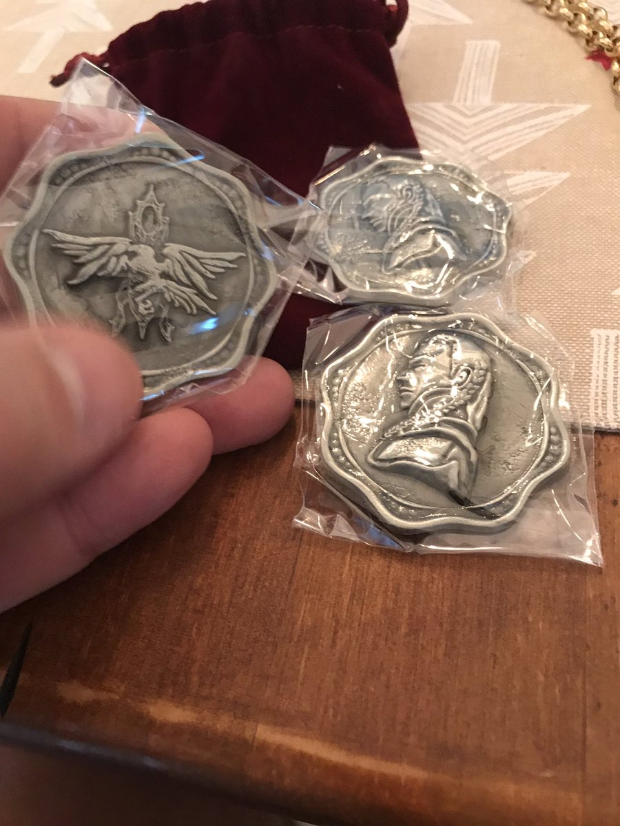 Props! The holy symbol of Ravenkind and three coins, embossed with Strahd’s face. These are metal. And heavy. Heavy metal. Imagine giving your players that! Very cool.