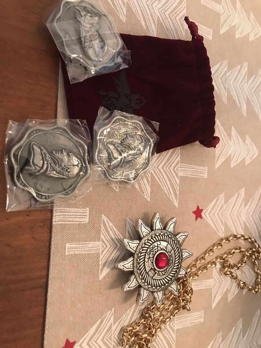 Props! The holy symbol of Ravenkind and three coins, embossed with Strahd’s face. These are metal. And heavy. Heavy metal. Imagine giving your players that! Very cool.