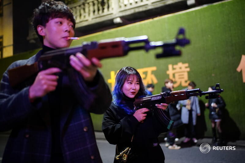 Outside, maskless partygoers spill onto the streets, smoking and playing street games with toy machine guns and balloons. Nightlife in Wuhan is back in full swing almost seven months after the city lifted its lockdown 2/6