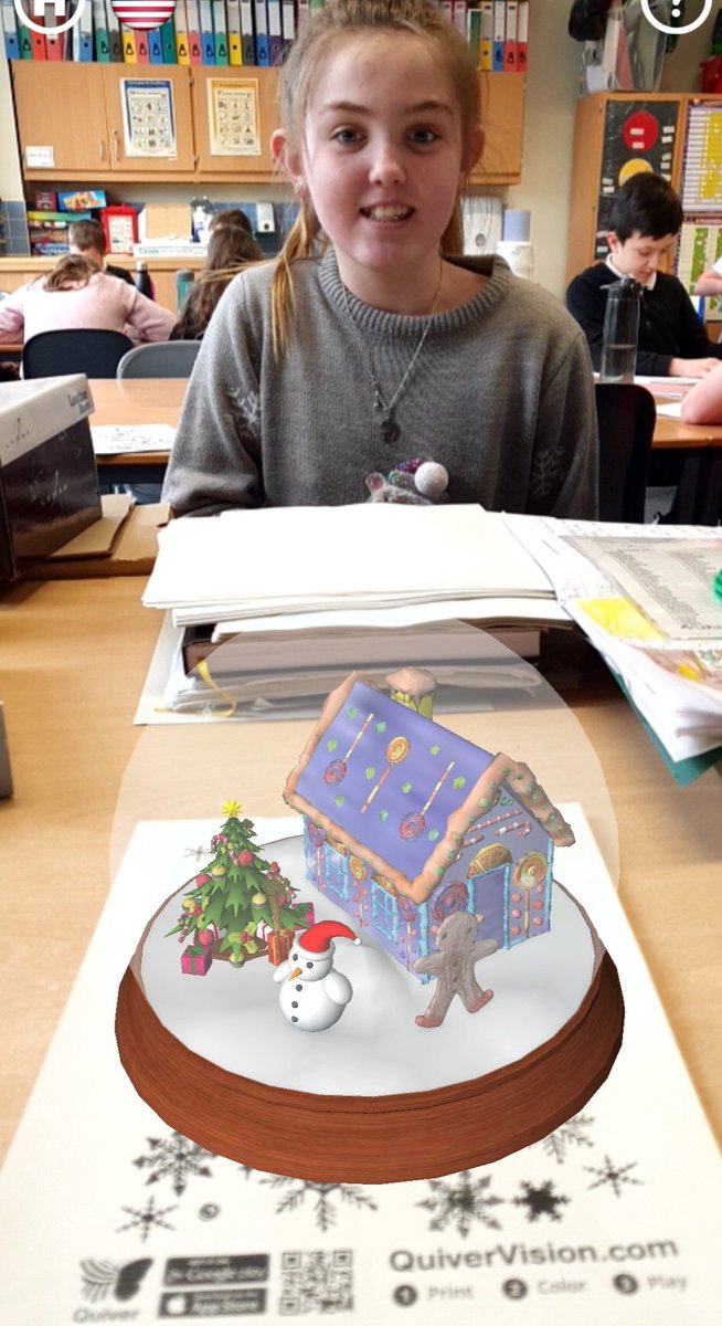 P6_7andMissG's tweet photo. Today we used @quivervision to turn our Christmas colouring into 3D virtual reality models! Great fun. Here  are K. and A. with their Christmas trees. A. is with her gingerbread house and the other one belongs to I.🎄☃️ https://t.co/mgsTZSbmEn