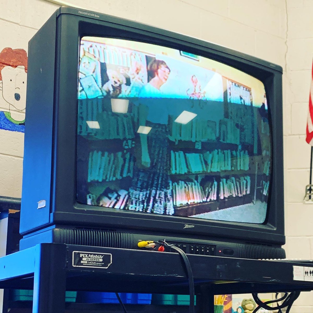wes_library's tweet photo. Today some of the staff and I cracked open the last VHS on the last VHS player in the school to see what was on it. There was no year but we think it’s from the late ‘90’s! So fun to see our building and library from years ago! #poweroflibraries #itsworthit #librariesareworthit https://t.co/DcqdpMVGY1