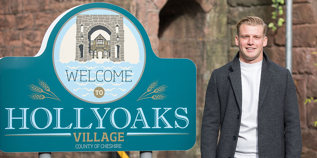 Hollyoaks's tweet photo. WOW! How about that for a reveal?! Feast your eyes on this familiar face... Seth Costello! Who's come back to the village, very in love, and up to no good with our Theresa McQueen! 😱 Can you believe what they've done? 😥

Also... WELCOME BACK, @MHigson! 🎉 #Hollyoaks https://t.co/rMxfH5vl4g