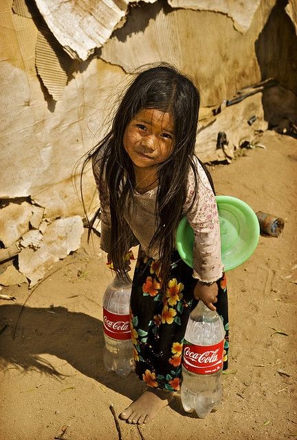 "It's the Real Thing" 

When weather is lost, nothing is lost; when heath is lost, something is lost; when character is lost, all is lost. Look at the sweat on this beautiful child's lip.. she has to get water from irritation ditch. and haul it up the hill to her family's shack.