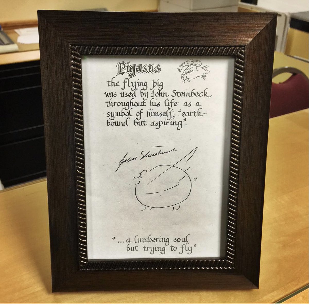 SteinbeckCenter's tweet photo. Pigasus, the flying pig, was used by Steinbeck throughout his life as a symbol of himself, "earthbound but aspiring." The symbol on the top right corner is a print of the stamp Steinbeck used while the Pigasus below his signature is Steinbeck's hand drawing of the symbol. https://t.co/r2Ufu5GHJ0