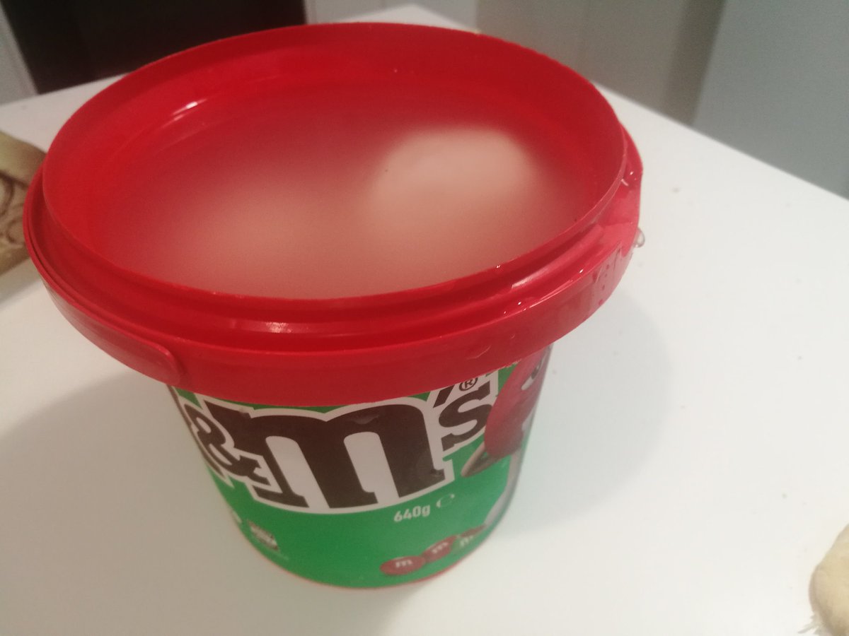 Classy large M&M tub of mozzarella left after making four pizzas.