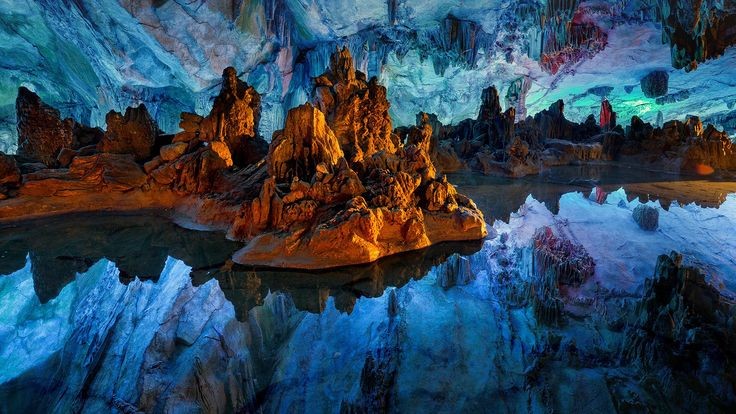 5. Reed Flute Cave: Guilin, ChinaSadly, magical fairy dust is not the secret behind Reed Flute Cave's glowing interior: Multi-colored lights have been hidden all around the subterranean spot to attract tourists.