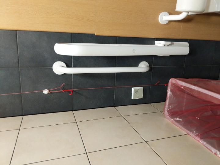 PAVATech's tweet image. Oh dear. A hook intentionally placed to hang up the toilet alarm cord. #lifesafety