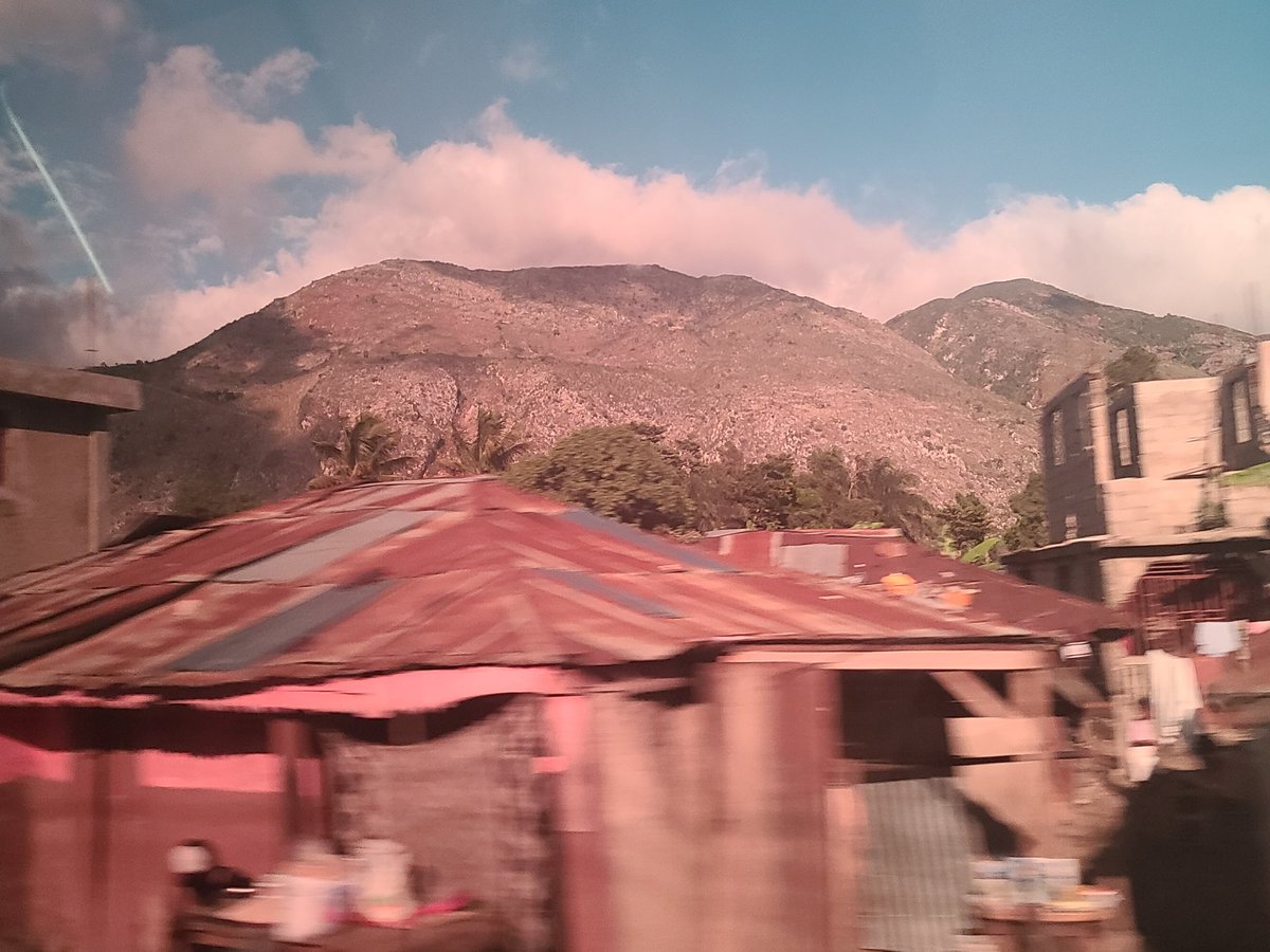 Saturday we hit the road for a 3 day excursion. No filter. Taken through dark tinted windows that made my black bag appear red.  #Haiti
