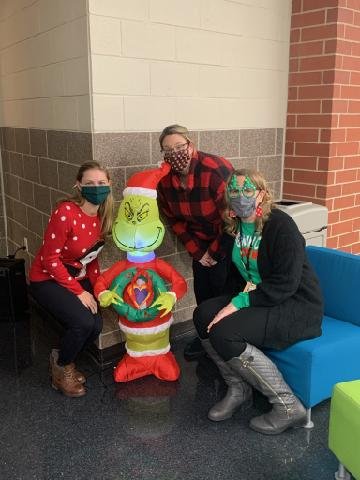 MKMathCoach's tweet photo. The #hcmsgrinch is hanging out at the tree lot today! I don't think the hot cocoa and Cinnabon will follow Tuesday's nutrition advice, but I sure have loved finding this guy every day! #growhisheart @CKDonovan5 your decorations are amazing!! @157cTechCoach @pozsquad https://t.co/argXpsC1ub