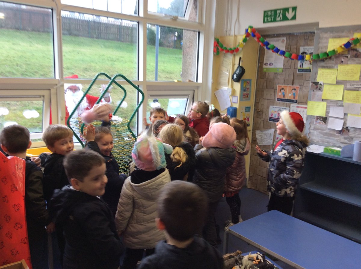 On Tuesday, we spoke to Santa on the phone and he said that he would try and pop past. We thought that he was too busy but he surprised us by coming to the window today! We were so excited and he even brought us a present! We hope you all have a lovely Christmas! <a href="/BrambleBraeSch/">Bramble Brae School</a>