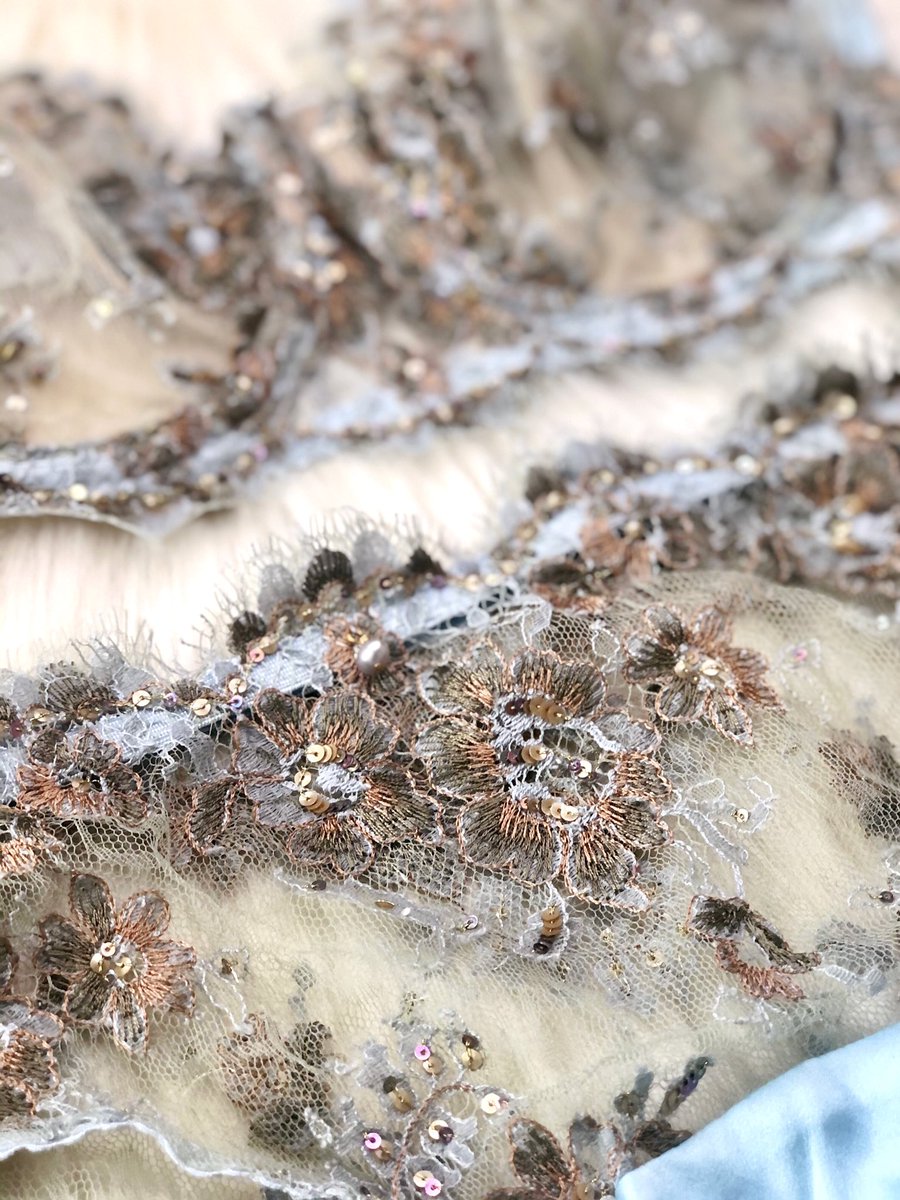 Coming back to the fabric, since that’s where this all began, look at the details on that re-embroidered Sophie Hallette Chantilly Lace. Multicolored threads, multicolored sequins, all done by hand. The edge of the lace itself is hand-trimmed too.