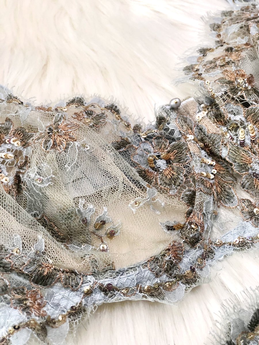 Coming back to the fabric, since that’s where this all began, look at the details on that re-embroidered Sophie Hallette Chantilly Lace. Multicolored threads, multicolored sequins, all done by hand. The edge of the lace itself is hand-trimmed too.