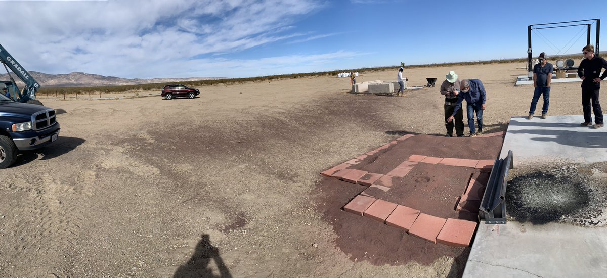 You can also see the ejecta field farther away from the regolith bed where the dark, larger particles rained down onto the lighter color of the natural Mojave soil. In rocket ejecta, larger particles generally go slower and less distance than dust. – bei  Mojave Desert