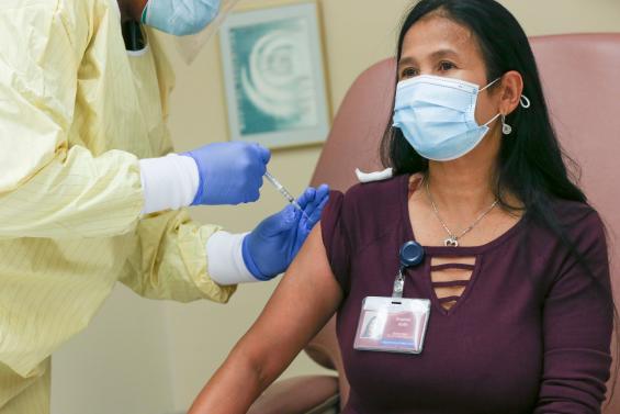 MassDPH's tweet photo. The first MA state employee to receive the COVID-19 vaccine is Sophal "Paula" Soth, a Janitorial Supervisor at DPH's Lemuel Shattuck Hospital in Jamaica Plain. Learn more: https://t.co/hqHO6QgqYp https://t.co/Qkkbk8mL61