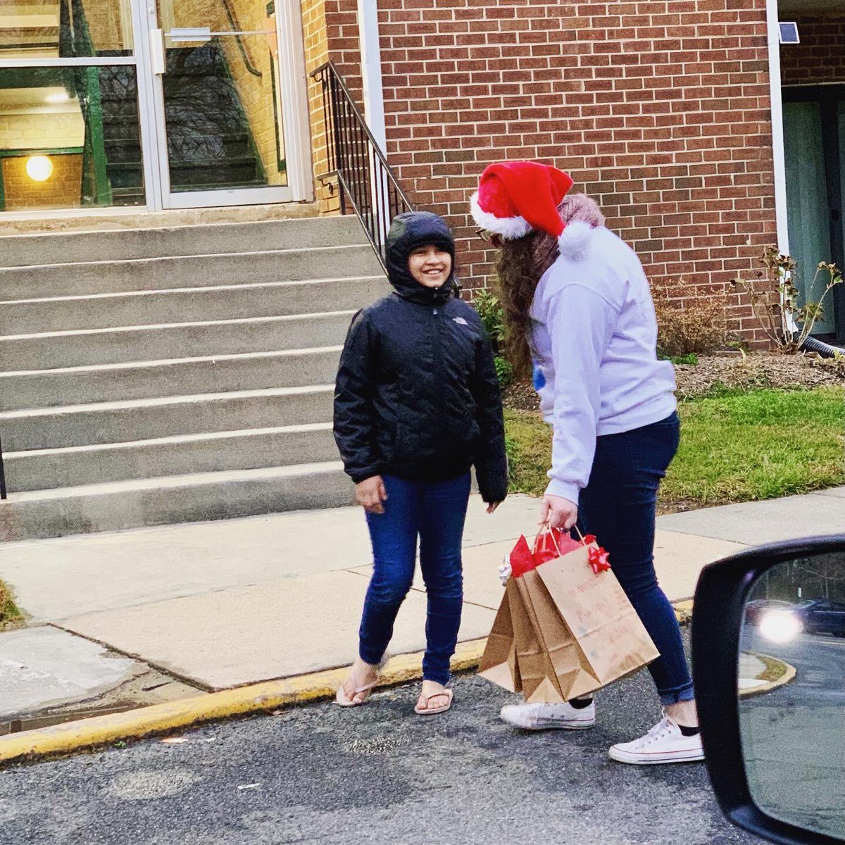 MsKatieFuchs's tweet photo. Delivered holiday presents after school today! The first time seeing kiddos in person since early September! Some were so excited they came running down the street to greet us! Loved every second of today. Happy winter break to all! @WoodlawnES @lcelliottFCPS https://t.co/q37tzfafQd