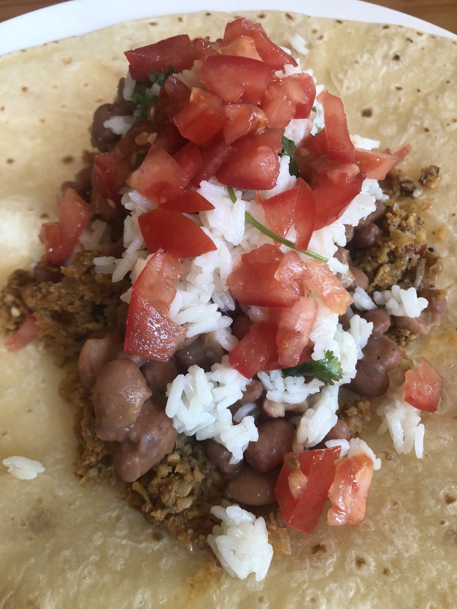 Various tacos: Tex-Mex, birria oxtail, breakfast, and a Chipotle burrito replica