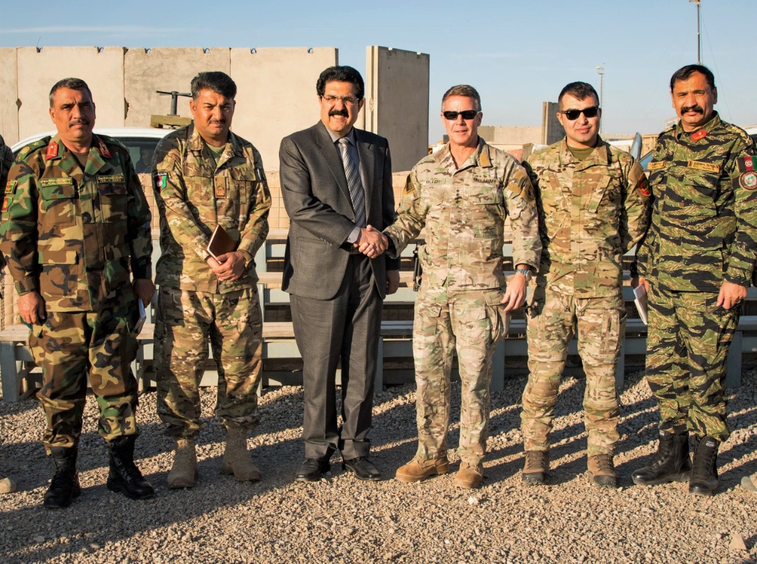 USFOR_A's tweet photo. Resolute Support Cdr. Gen. Scott Miller visited #Helmand on Thursday to assess the security situation & meet with provincial leaders. He congrat’d Brig. Gen. Sami Sadat on his appointment as 215th Maiwand Corps CDR, overseeing #Afghan Army operations in Helmand & #Nimroz https://t.co/zMgPR0MpUB