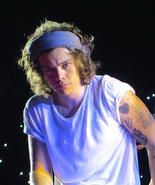 on stage. back stage. on his head.. around his neck... there's always a blue bandana .