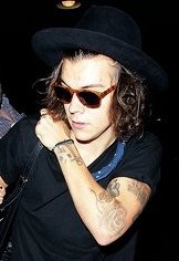 arrives at LAX wearing ofc the F*CKING BANDANA