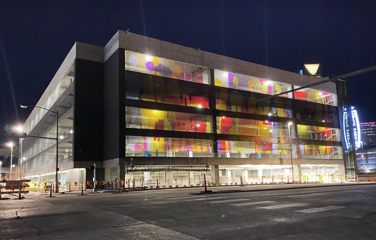 Glass mural being installed at the parking garage for the new convention center and Omni hotel.