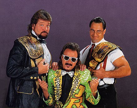 Such an underrated tag team.

They meshed well together.

@MDMTedDiBiase & #MikeRotunda (Money Incorporated) w/ their manager, @RealJimmyHart 👍💲