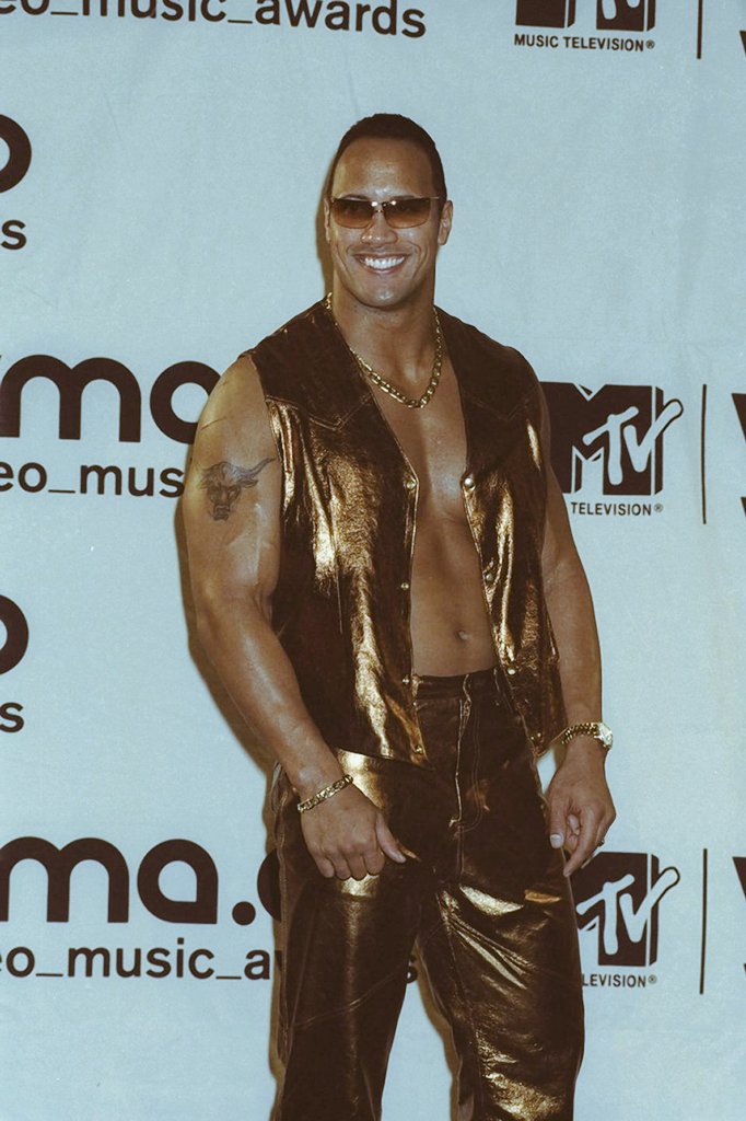 By 2000, The Rock was a massive superstar. His autobiography was #1 on the NYT bestseller list. In April, he hosted SNL. Access Hollywood named him #6 in the list of Top 10 Celebrities of 2000 and was one People Magazine's list of the Top 25 Most Intriguing People.
