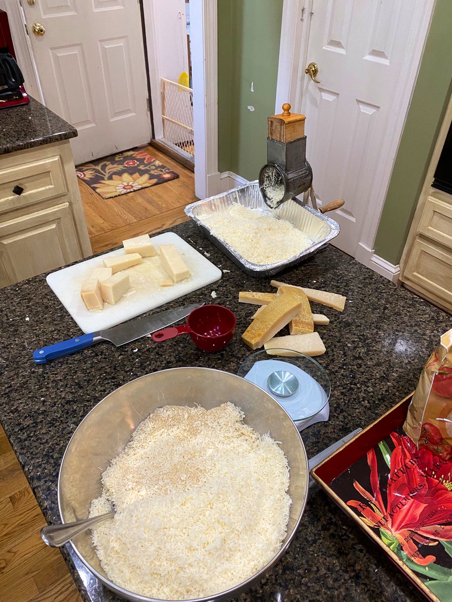 2lbs of Reggiano grated with a 100-year-old cheese grater from Bethpage, Long Island. Christmas ravioli making has commenced. [ravioli emoji]