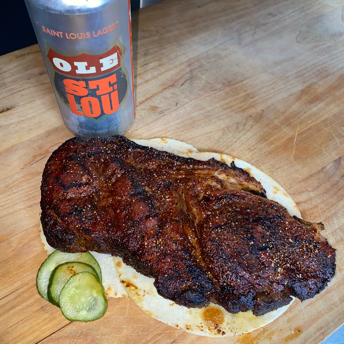Our famous 30oz Porksteak. Smoked on hickory and then grilled and basted with our Standard BBQ Sauce. Paired here with at <a href="/HeavyRiffBeer/">Heavy Riff Brewing</a> Ole St. Lou St. Louis Lager. #porksteak #hickorysmoke #localbrew #bbq