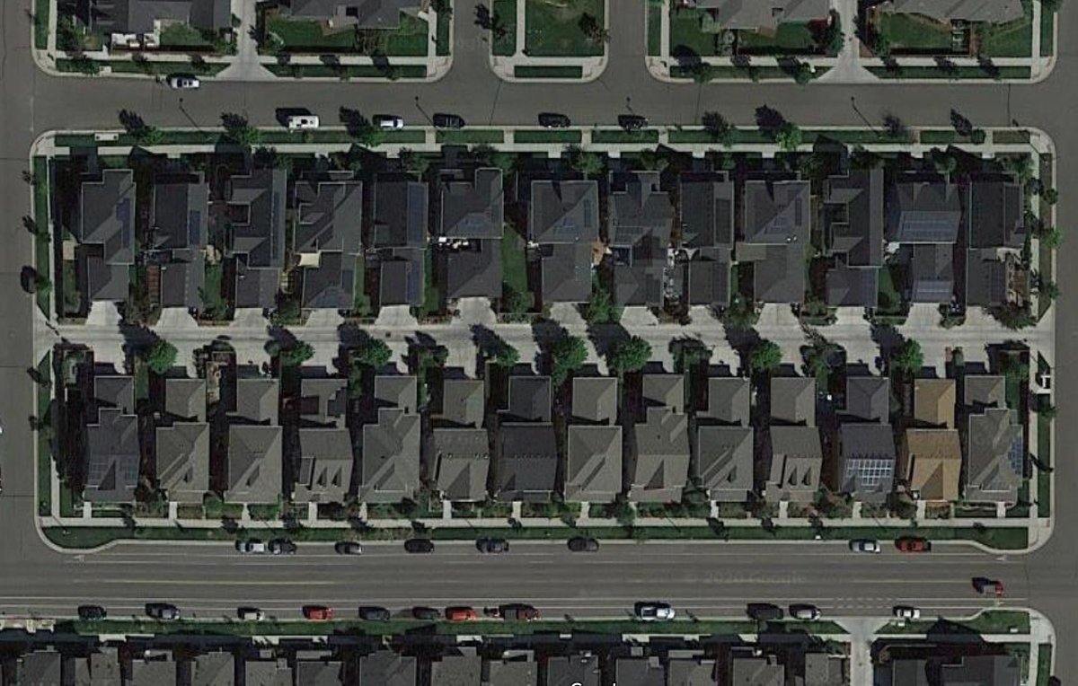 With the street/alley pattern, so much area had become devoted to ROWs that lots grew elongated to the point of impracticality to achieve an acceptable ratio of public to private land, and rear garages left little or no room for yards