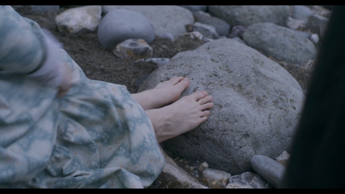  #Ammonite captures a woman's psychic change through shots of her feet at the beach. Initially, they are booted. Finally, they rest naked on a rock. She peels off layers as her affection for another grows, letting her body ever closer to nature and to its natural desires.