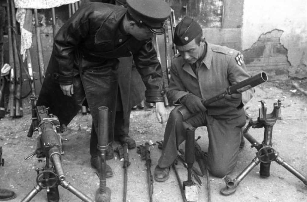 US soldiers inspecting some of the captured Japanese weapons in Changde, China. You just dont want to go too far in these archives then you get to the mass japanese soldier graves