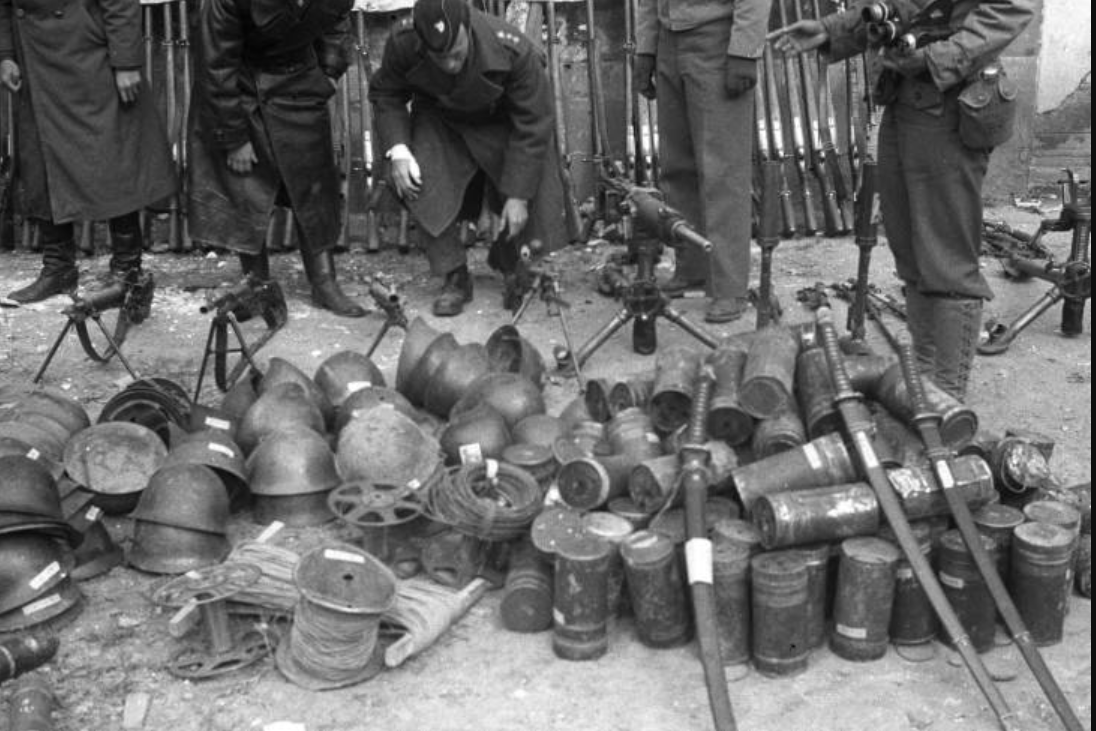 US soldiers inspecting some of the captured Japanese weapons in Changde, China. You just dont want to go too far in these archives then you get to the mass japanese soldier graves