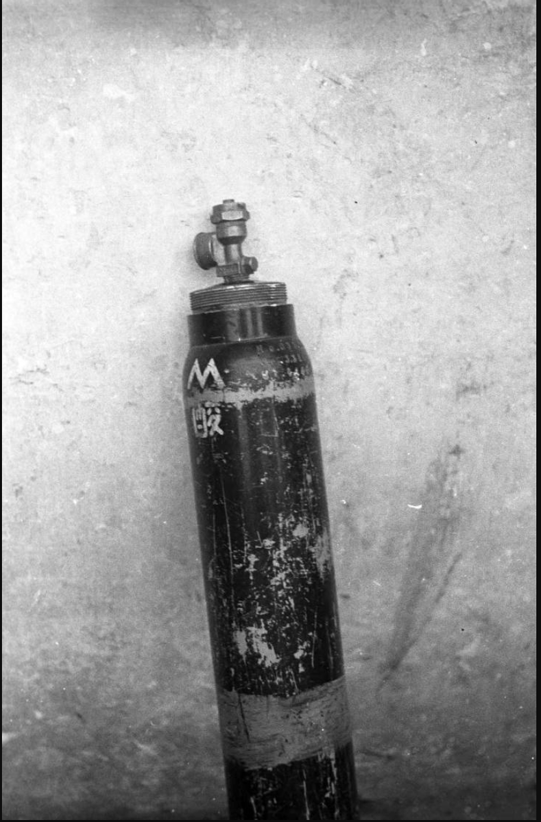 Chinese soldier with a Japanese chemical weapons canister in Hunan province, 1943