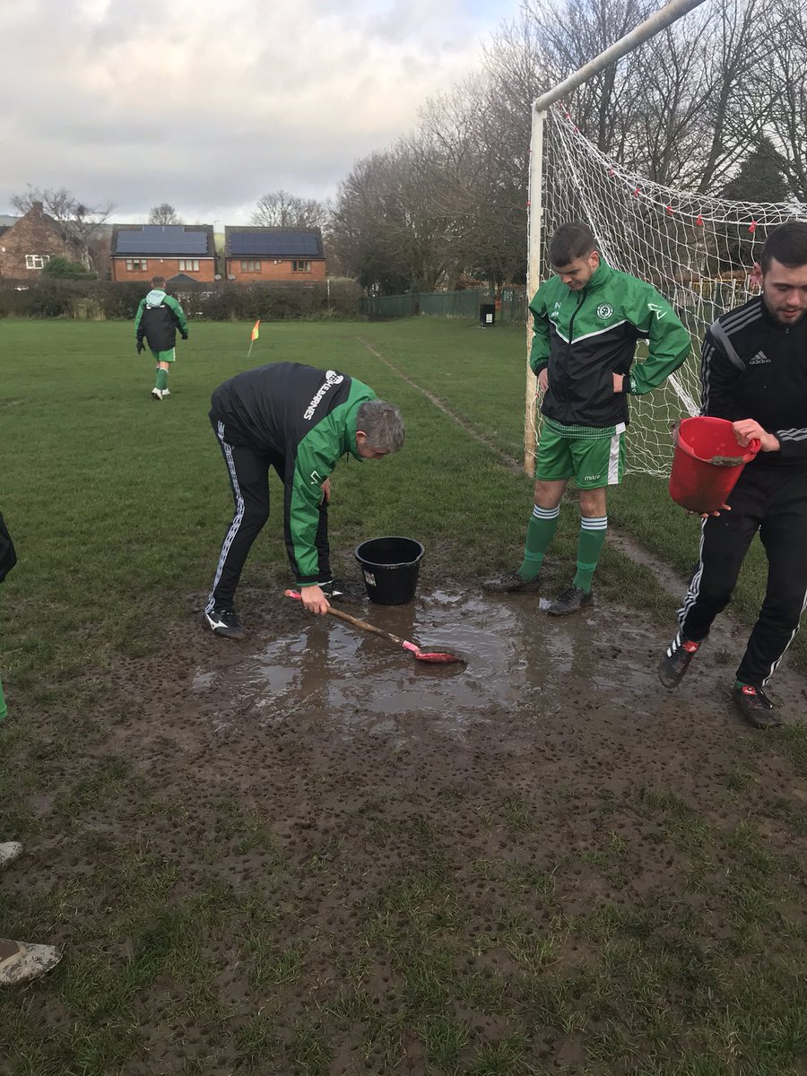 SRangers2020's tweet photo. This morning manger @sparkymarky7 and @JDavison99 are on pitch maintenance duty emptying the mud bath in the 6 yard box. #SundayLeagueProblems https://t.co/tZFIJv7PC0