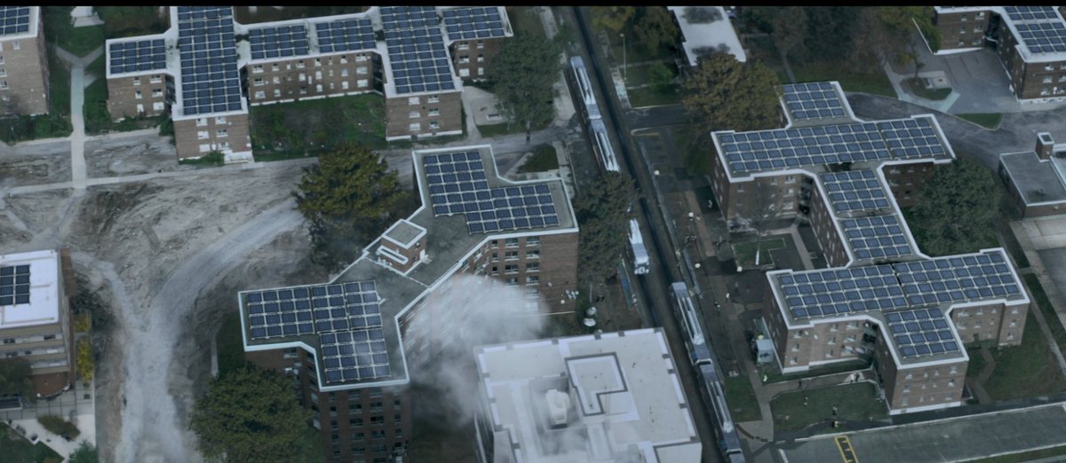 Episode 2 of Season 5 has plenty of rich detail, now there are longer scenes on Earth. Baltimore is a post-climate city: a sea higher than the city itself, widespread apartment solar. Interestingly: not a single car; but a heavy, prominent (electric?) train, cycles, walking.