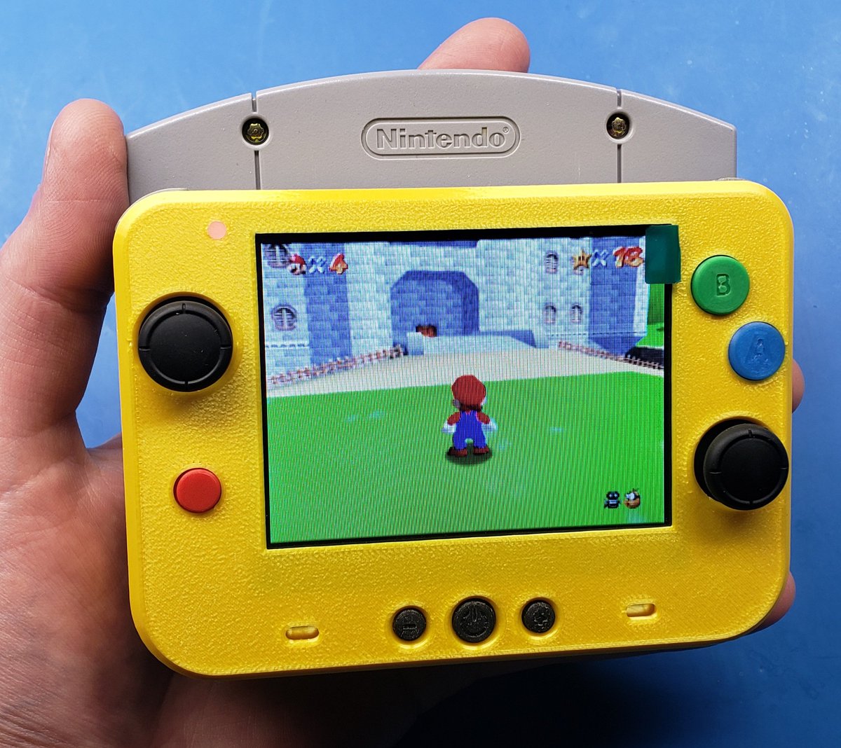 I have finally fulfilled my destiny of building the world's smallest N64 portable