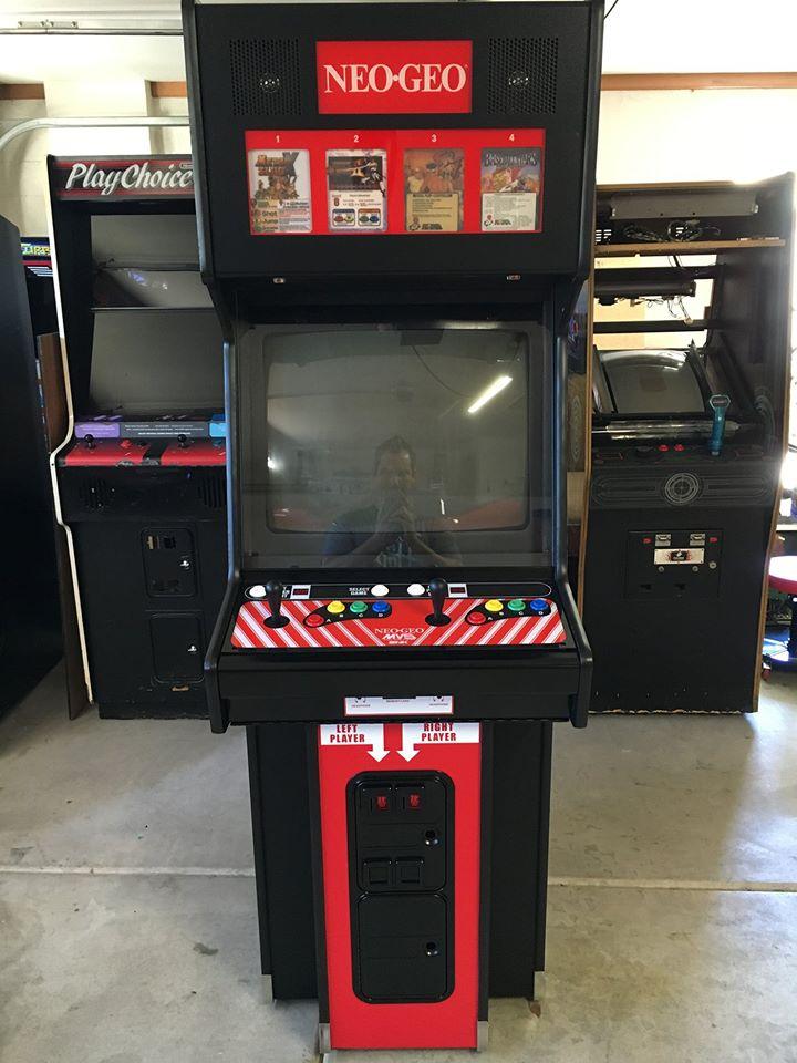 Nestled, in the corner were a bunch of arcade games. One being a pinball machine which I probably mosaic'd out of my head and the rest were either beat'em ups or fighting games but one caught my eye that I'd never seen before. The MVS cabinet.