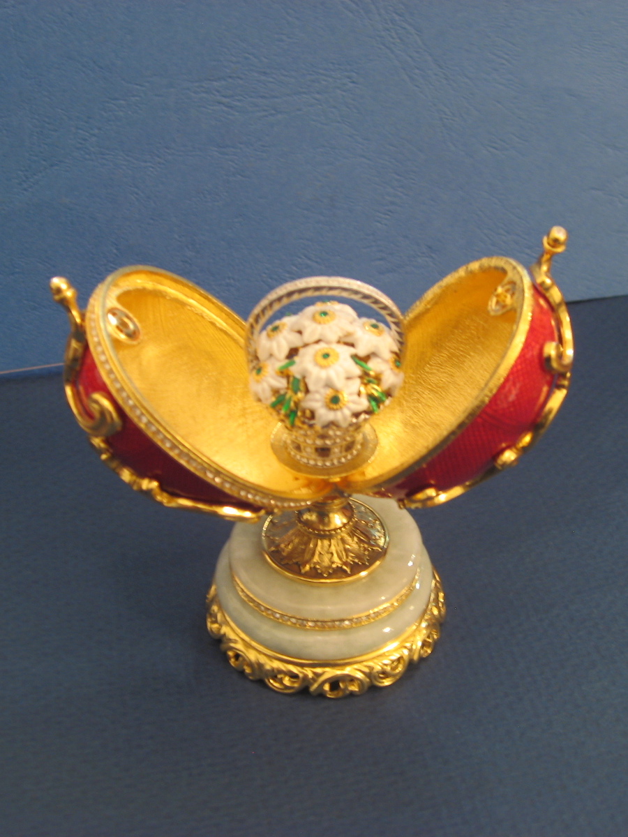 a fully removable bower of flowers made of garnets and white chalcedony in a basket of platinum. It was purchased by Russian businessman Viktor Vekselberg in 2004 as part of a collection of such eggs and various other Fabergé items.