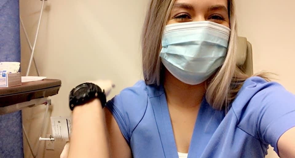 carthagecollege's tweet photo. We’re glad to share something so happy that you can see the smile behind the mask. Emma Kopitke ‘20, a nursing graduate currently working at @LoyolaHealth, received the first dose of her COVID-19 vaccine today. 

Vaccines and amazing frontline workers like Emma help save lives. https://t.co/aUeBaajqER