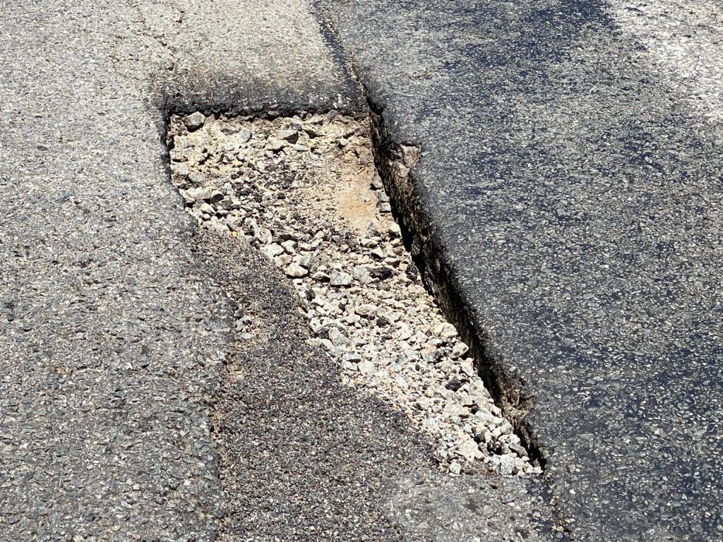 VTacGreenTeam's tweet photo. Where we can we put cones &amp; close up potholes in the neighbourhood to make it safer for residents, but the freeway is a little more difficult for us to work on for obvious reasons. 

This monster in the road is wrecking havoc as you take Glenhove into Houghton. https://t.co/iymxUV26o4