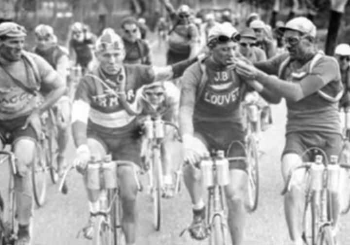 CYCLIST SMOKING CIGARETTES WHILE RIDING THE TOUR DE FRANCE.