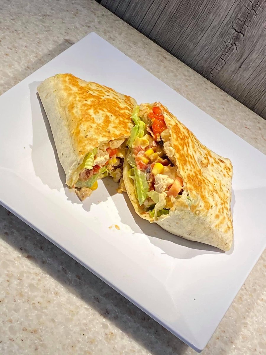 Generoasta's tweet image. Meet one of the newest additions to our lunch menu, the “Arizona” wrap.

The “Arizona” is a flavor packed wrap made with chicken, bacon, avocado, roasted reds, smoked gouda, corn salsa, diced tomato, romaine and chipotle ranch all piled on a garlic basil tortilla.  #generoasta