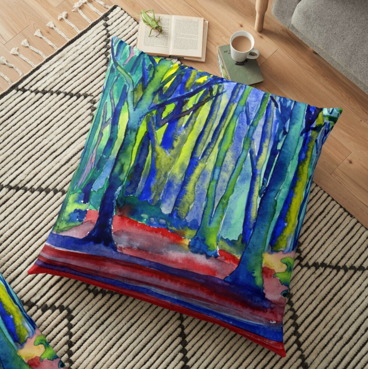 A floor cushion with a very colourful design of trees in red, blue, purple, green and yellow. Psychedelic and fun.