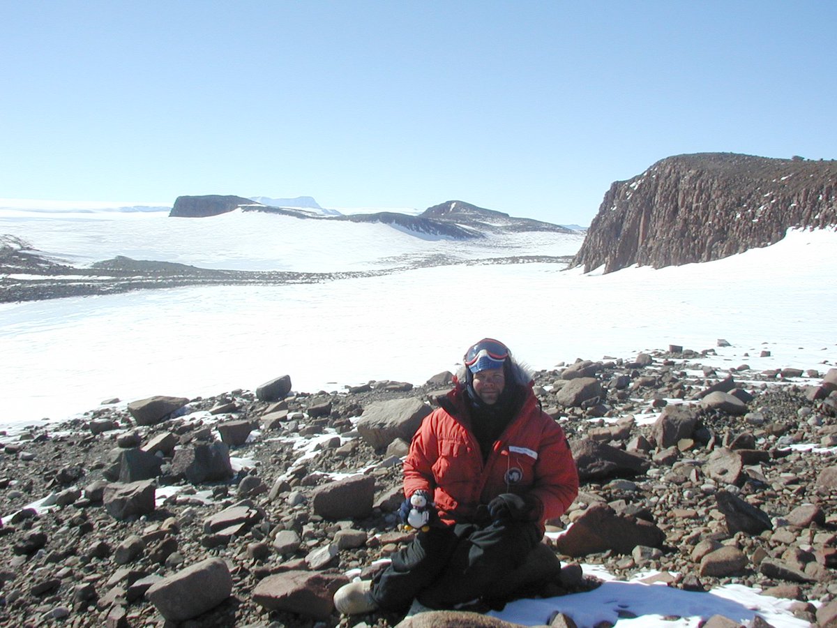 12-21-2000 Me and a penguin and field guide John Schutt in his tent  #ANSMET2000